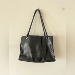 Woman’s black shoulder purse